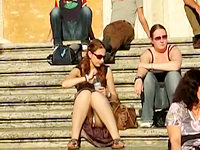 The shameless girl that is sitting on the stairs seems to know she demonstrates her panty upskirt but she does not care